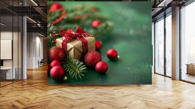 Gift with red ribbon among Christmas decorations Wall mural