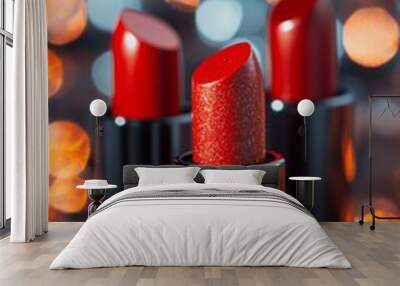 Luxurious red lipsticks with shimmering finishes shine against a glowing, blurred background to enhance your makeup collection Wall mural