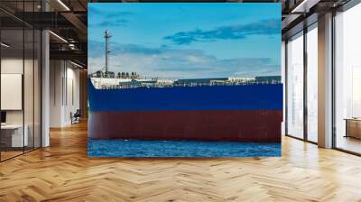 Blue cargo ship underway Wall mural