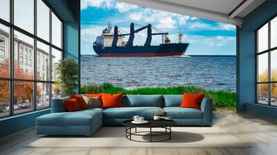 Blue cargo ship underway Wall mural