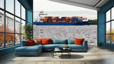 Blue container ship moving to Baltic sea. Riga, Latvia Wall mural