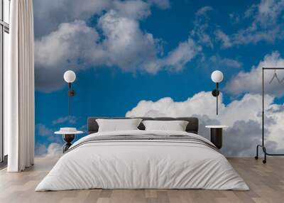 Beautiful blue sky with fluffy white clouds. Sky clouds backgrounds. Wall mural