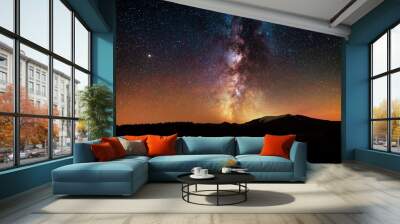 The bright milky way galaxy on the starrry sky over the mountains.  Night landsckape. Astronomical background. Wall mural