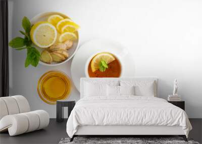 Fresh tea with lemon and honey on a white background. Hot tea cup isolated, top view flat lay. Flat lay. Autumn, fall or winter drink. Copy space. Wall mural