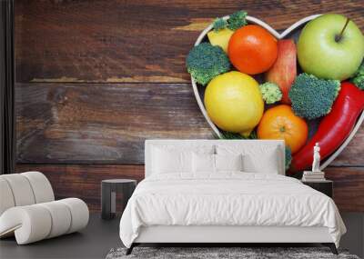 Fruits and Vegetables in Heart shaped Wooden Box. Broccoli, apples, Pepper, tangerine over Wooden Background. Banner. Health food Concept with copy space. Wall mural