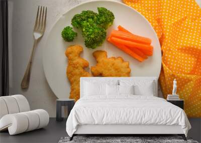 Kids food. nuggets with vegetables. Dinosaur shaped chicken, fish or turkey nuggets, ready to eat. Wall mural