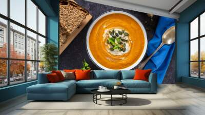 Pumpkin vegetable soup and sourdough bread. Top view. Wall mural