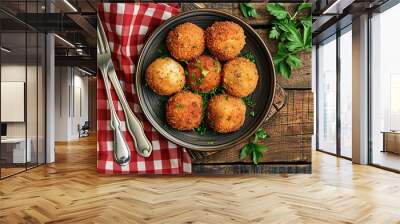 A top down view of a rustic plate of traditional Dutch bitterballen, a bitesized meat and gravy croquette served as a snack in bars. Wall mural