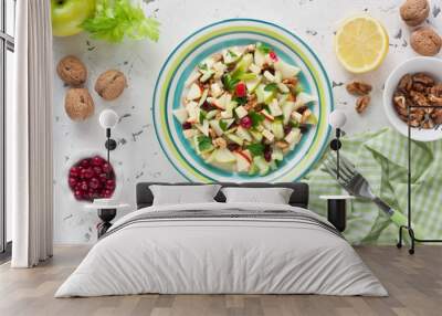 Waldorf Salad / Delicious Waldorf Salad with apple, walnut, celery, cheese and dried cranberries on white rustic background Wall mural