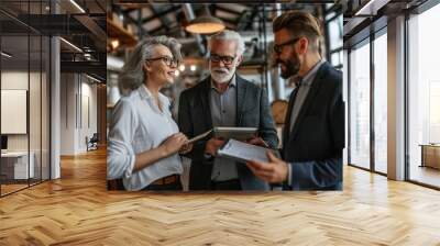 Business people working together in a modern office. Businessmen and businesswomen working together in a modern office. Wall mural