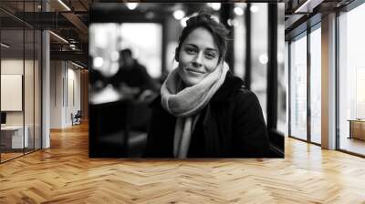 Portrait of a beautiful woman in a cafe. Black and white photo. Wall mural