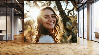 portrait of a beautiful young woman with freckles on her face in an olive grove Wall mural