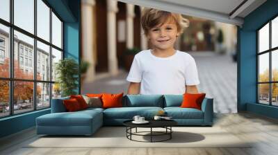 Portrait of a cute little boy in a white t-shirt Wall mural