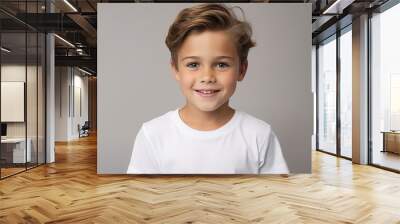 Portrait of a cute smiling little boy with blond hair in a white t-shirt Wall mural