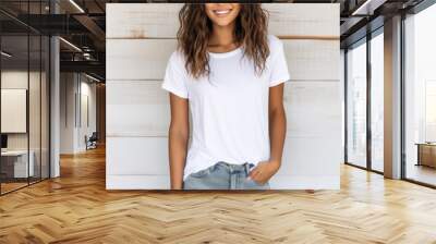 Woman standing in front of a wood backdrop, wearing a blank Bella Canvas 3001 style t-shirt, shirt mockup, white shirt, trendy, fashion Wall mural