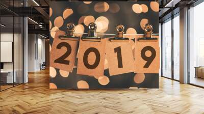 2019 new year sign pegged to a string with blurred bokeh lights in the background Wall mural