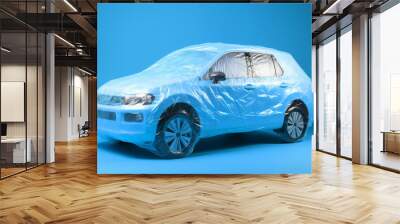 A car wrapped in a protective cover. Car insurance concept. Generative ai Wall mural