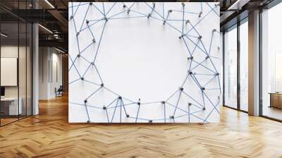 A large grid of pins connected with string. Communication, technology, network concept Wall mural