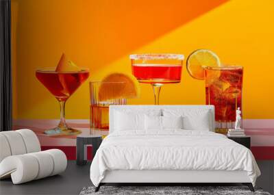 A row of summer tropical holiday cocktails on a bright background with hard directional sun shadow Wall mural