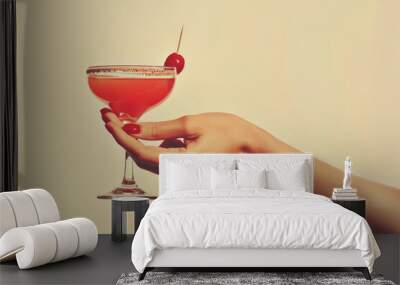 a vintage retro female hand holding a cocktail isolated on a plain background, 1960s and 70s style Wall mural