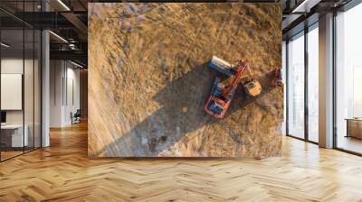 Aerial view over heavy machinery on a building construction site Wall mural