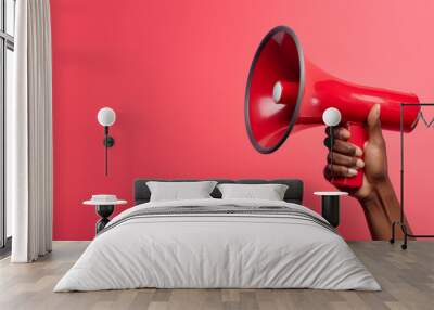 African american persons hand holding an announcement megaphone Wall mural