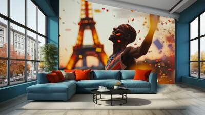 An athlete celebrating winning a sports event. Confetti falling and Paris Eiffel tower in background Wall mural