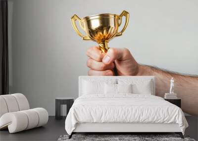 Close up of a hand holding a winners trophy trophy Wall mural