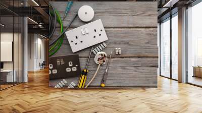 Electrical tools and equipment on a wooden background Wall mural