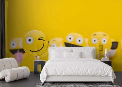 Emoji smiley social media characters on a yellow background Wall mural