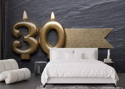 Gold number 30 celebration candle with glitter label Wall mural