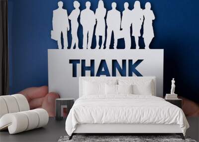 Hands holding a thank you white card business team people sign Wall mural