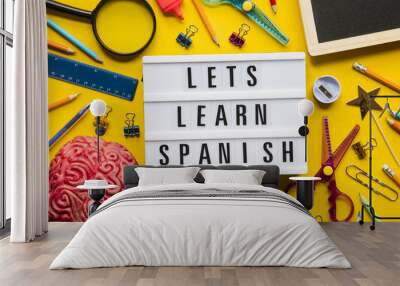 Lets learn spanish lightbox message on a bright yellow background Wall mural