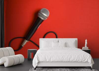 microphone and lead on a bright red background. Wall mural