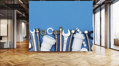 plumbing tools and equipment overhead view on a blue background Wall mural