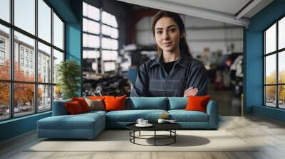 Portrait of a female mechanic working in a repair garage. Generative ai Wall mural