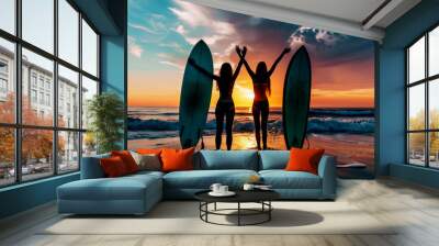 Silhouette of beautiful people posing on a beach at sunset with surfboards Wall mural