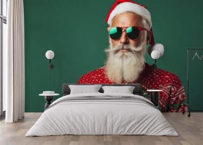 Studio portrait of a trendy Father Christmas character wearing a festive christmas ugly jumper Wall mural