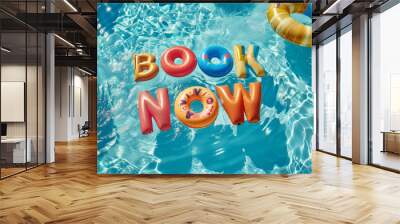 Summer vacation Book now message. Pool floats in a holiday swimming pool Wall mural