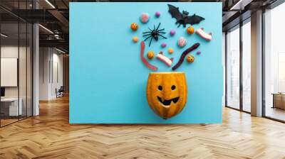 Trick or treat halloween candy coming from a pumpkin head Wall mural