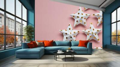 White and gold star decorations on a pastel pink. Seasonal festive background Wall mural