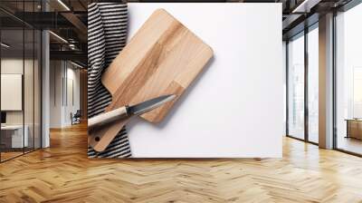 Wooden chopping board and knife with a striped cloth Wall mural