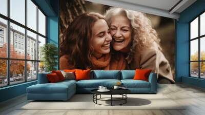 Young woman with older mother cuddling together. Mothers day. Generative ai Wall mural