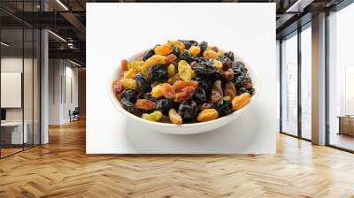 Raisins of all colors mixed and dried in isolation on a white background Wall mural