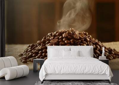 Heap of fresh roasted coffee beans on burlap fabric with steam rising above. Wall mural