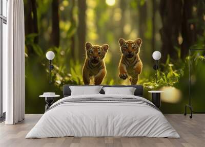 Two Tiger Cubs Running Through Green Forest with Sunlight Wall mural