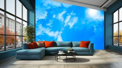 Beautiful blue sky with sunbeams and soft clouds. Wall mural