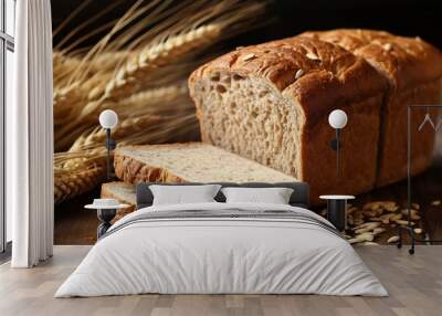 Bread with ears of wheat on wooden background . Wall mural