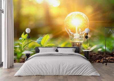 Light bulb glowing among green plants, symbolizing sustainable and innovative energy in a natural environment. Wall mural