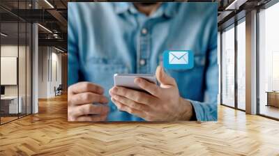 Man using smartphone to check and read new email notifications. Digital communication and technology concept. Wall mural